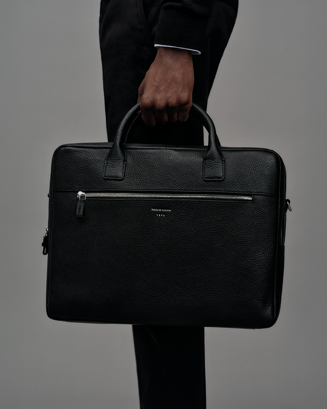 Man holding a black briefcase